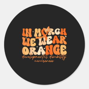 Sticker Rond En mars porter un trouble du développement orange