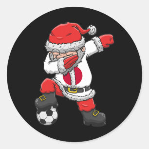 Sticker Rond Garçon de football faisant le dab avec le Père Noë