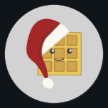 Sticker Rond gaufre de Noël<br><div class="desc">Jolie gaufre portant un chapeau de Père Noël</div>