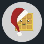 Sticker Rond gaufre de Noël<br><div class="desc">Jolie gaufre portant un chapeau de Père Noël</div>