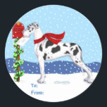 Sticker Rond Great Dane Christmas Mail Harlequin UC Tags cadeau<br><div class="desc">Noël avec des Danois de Danes-R-Us : Ce Grand Danois se promène dans la neige pour emmener ses voeux de Fêtes à la boîte aux lettres en portant son foulard tricoté rouge.</div>