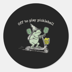 Sticker Rond Grenouille sorcière tenant une raquette Trottinett
