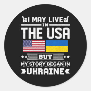 Sticker Rond Je vis peut-être aux États-Unis mais mon histoire