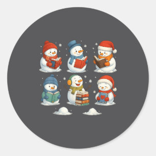 Sticker Rond Joli bonhomme de neige lisant des livres de Noël h