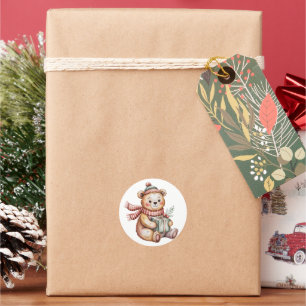 Sticker Rond Joli ours en peluche de Noël tenant un cadeau en a