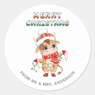 Sticker Rond Jolie vache de Noël en costume d'hiver