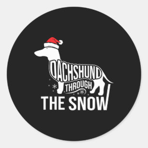 Sticker Rond Joyeux Chien De Noël À Travers La Neige Coupée