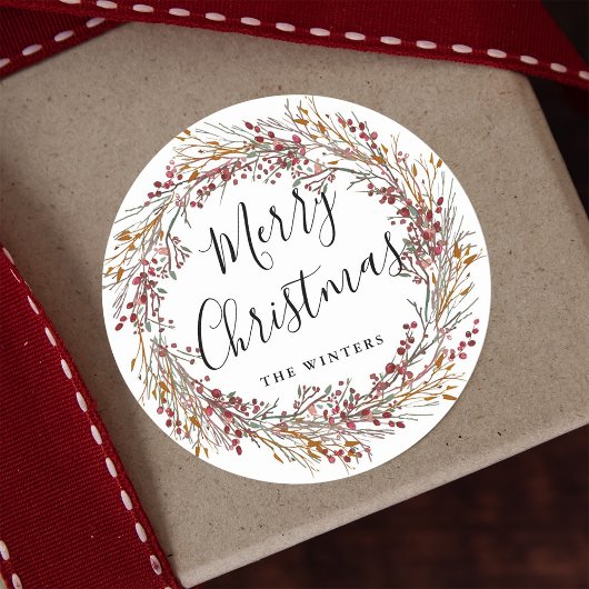 Sticker Rond Joyeux Noël à la couronne rouge d'hiver