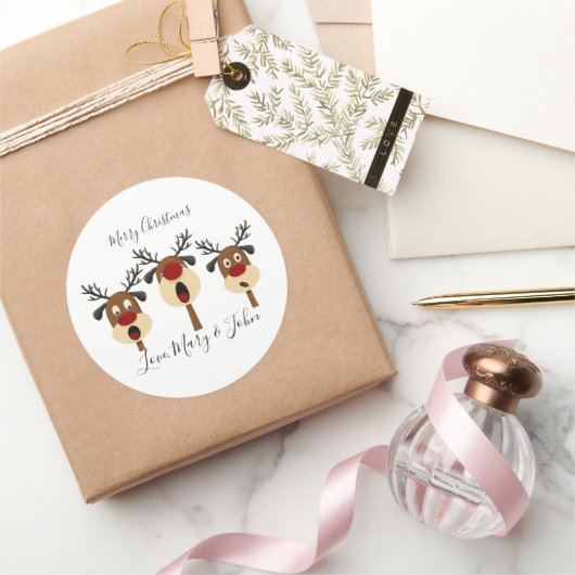 Sticker Rond joyeux noël chanter des rennes (Cadeaux)