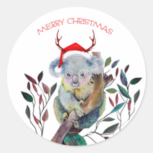 Sticker Rond Koala de Noël portant un chapeau de Père Noël