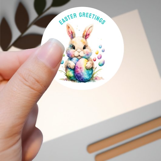 Sticker Rond Lapin de voeux de Pâques et ses oeufs peints
