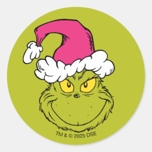 Sticker Rond Le Grinch avec un chapeau de Père Noël rose