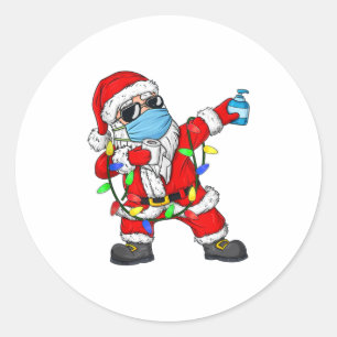 Sticker Rond Le Père Noël en train de porter un masque