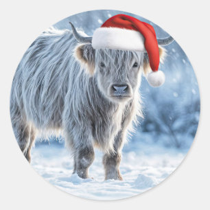 Sticker Rond Le veau des Highlands dans la neige Joyeuses vacan