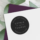 Sticker Rond Mariage noir Adresse de retour moderne<br><div class="desc">Cet autocollant d'adresse de retour mariage présente les noms du couple mariage et l'adresse en blanc contre une couleur noire. Consultez les éléments mariages correspondants ici https://www.zazzle.com/collections/119930609931325936 Personnalisez-le en remplaçant le texte de l'espace réservé. Pour plus d'options comme changer la police, sa taille et l'espacement entre les lettres cliquez sur...</div>