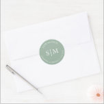 Sticker Rond Mariage vert Sage Monogrammé<br><div class="desc">Ces autocollants de mariage présentent le nom de la mariée et du marié, les initiales monogrammées et la date du mariage en blanc sur une solide couleur verte à la sauge. Utilisez-les pour vos scellés d'enveloppe mariage. Pour voir les articles correspondants de Victoria Grigaliunas visitez DoTellABelle sur Zazzle à www.zazzle.com/dotellabelle...</div>