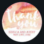 Sticker Rond Merci D'Aquarelle Romance Chaud<br><div class="desc">Ce design moderne présente un arrière - plan d'aquarelle rose et jaune avec un "Merci" écrit à la main. Parfait pour mettre sur ces faveurs de mariage ou des cartes de remerciement! Recherchez la coordination des produits et autres conceptions dans la section Mariage.</div>