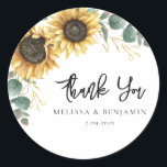 Sticker Rond Merci de script Mariage de tournesol Eucalyptus<br><div class="desc">Créez un autocollant floral de tournesol moderne grâce à ce modèle mignon avec de beaux bouquets fleuris rustiques, des feuilles d'effet or géométrique, avec une typographie simple moderne. CONSEIL : Des cartes de suite mariage comme RSVP, des programmes de mariage, des bannières, des tapisseries, des étiquettes cadeaux, des affiches, et...</div>