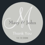 Sticker Rond Merci gris argenté Mariage monogramme sceau<br><div class="desc">Monogramme Stickers Initial avec nom de mariée et de mariée, date du mariage et un message de remerciement à l'express de votre gratitude le jour de votre mariage ou toute occasion spéciale. Plus de couleurs sont disponibles pour votre choix. Vous pouvez également customiser la couleur et la police à l'aide...</div>