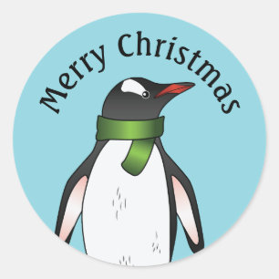 Sticker Rond Mignon manchot papou portant une écharpe verte sur