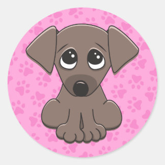 Sticker Rond Mignonne, chien de chiot brun sur empreinte de pat