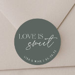Sticker Rond Modern Dark Sage Green Love is Sweet Wedding Favor<br><div class="desc">Autocollants et étiquettes personnalisés pour le mariage avec "l'amour est doux" moderne vert foncé et design blanc avec nom et date personnalisés.</div>