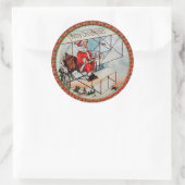 Sticker Rond Noël Père Noël pilotant un vieil avion (Sac)