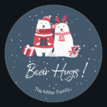 Sticker Rond Ours polaire Hugs Christmas ID851<br><div class="desc">Cet autocollant fantaisiste de Noël est orné d'un arrière - plan bleu profond surmonté de personnages d'ours blancs et rouges et d'un texte de typographie de 'Bear Hugs.' Un modèle fourni vous permet d'ajouter facilement votre nom ou autre texte. Recherchez ID851 pour voir tous les produits de coordination pour cette...</div>