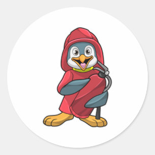 Sticker Rond Penguin comme pompier avec extincteur