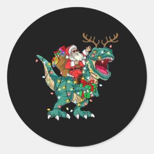 Sticker Rond Père Noël montant un dinosaure T Rex cerfs enfants