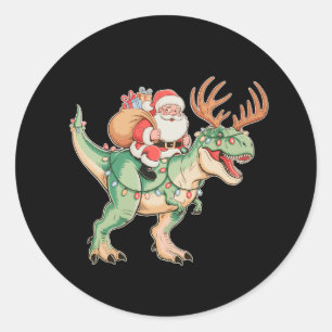 Sticker Rond Père Noël montant un dinosaure T Rex Noël vacances