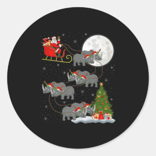 Sticker Rond Père Noël rhinocéros traîneau volant drôle magique