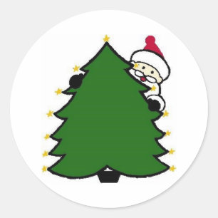 Sticker Rond père Noël se cache derrière l'arbre de Noël