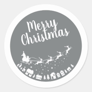 Sticker Rond Père Noël silhouette de traîneau volant au-dessus 