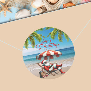 Sticker Rond Père Noël sous un parasol de plage de Noël