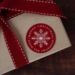 Sticker Rond Personalized Christmas Snowflake<br><div class="desc">Seal your Christmas cards and gifts with these sweet personalized stickers,  featuring a holiday red background with a white snowflake in the center,  encircled by your custom greeting and name(s). Shown with "Merry Christmas."</div>