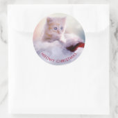 Sticker Rond Petit Kitten reposant sur un chapeau de Noël Meowy (Sac)