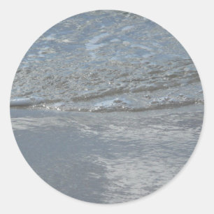 Sticker Rond Photographie abstraite de l'eau clapotant sur la p