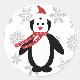 Sticker Rond Pingouin dans la neige avec Casquette Père Noël su