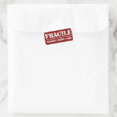 Sticker Rond Poignée fragile avec article de soins (Sac)