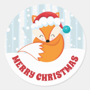 Sticker Rond Renard mignon avec chapeau de Père Noël dans la fo