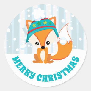 Sticker Rond Renard mignon avec chapeau d'hiver dans la forêt e