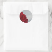 Sticker Rond Roses rouges contre un ciel bleu vif (Sac)