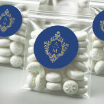 Sticker Rond Royal Blue Gold Crest Monogram Vintage Wedding<br><div class="desc">Un monogramme élégant dans une crête vintage, approprié pour un mariage avec mariage bleu royal et or. La crête est faux or, les 2 initiales sont dorées, séparées par une petite ligne dorée, l'arrière - plan est bleu royal. La crête florale vintage d'un ancien livre reliant, du livre "Rust, Smut...</div>