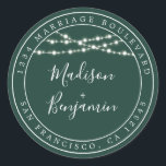 Sticker Rond Rustic Lights Dark Green Mariage Adresse de retour<br><div class="desc">Mariage moderne et chic, le nom d'adresse de retour avec vos noms en blanc élégant script manuscrit sur un arrière - plan vert foncé avec une touche élégante de lampes à cordes rustiques de fées. Ajoutez simplement vos noms et votre adresse. Conçu exclusivement pour vous par Happy Dolphin Studio. Si...</div>