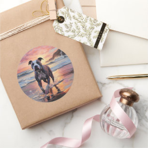 Sticker Rond Sandy American Staffordshire Dog on Beach Sunset
