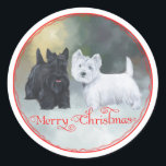 Sticker Rond Scottie Westie Christmas<br><div class="desc">Venez visiter notre magasin Maggie Ross Scotties pour voir tous les modèles montrant Scottish Terriers et West Highland White Terriers ensemble dans des décors saisonniers. Maggie et Ross étaient les noms de nos chiens Westie et Scotty et ils vivent dans mon oeuvre d'art. Choisissez notre outil de texte facile pour...</div>