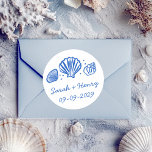 Sticker Rond Seashells Beach Wedding Blue White CUSTOM<br><div class="desc">Perfect cute sticker for a fun wedding or engagement! Hand made art for you! Perfect for a wedding, seaside bridal shower, bachelorette party, engagement party, anniversary or even special birthday. FULLY CUSTOMIZABLE! Click on “Personalize” above to edit the text.. Click "edit using design tool" to adjust the fonts, colors and...</div>