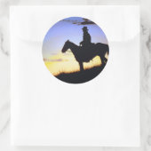 Sticker Rond Silhouette du coucher de soleil de cowboy occident (Sac)