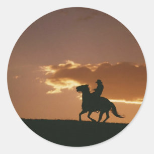Sticker Rond Silhouette Galloping Cowboy
